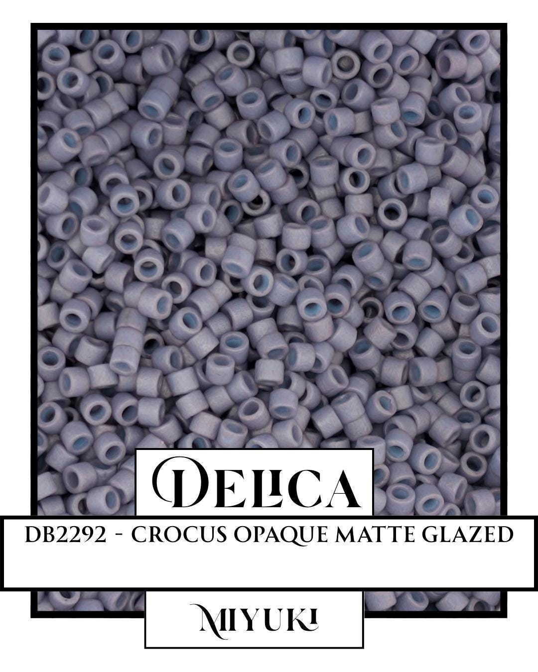 A close-up image of a pile of small, white, circular objects, possibly beads or buttons, arranged in a visually appealing manner.