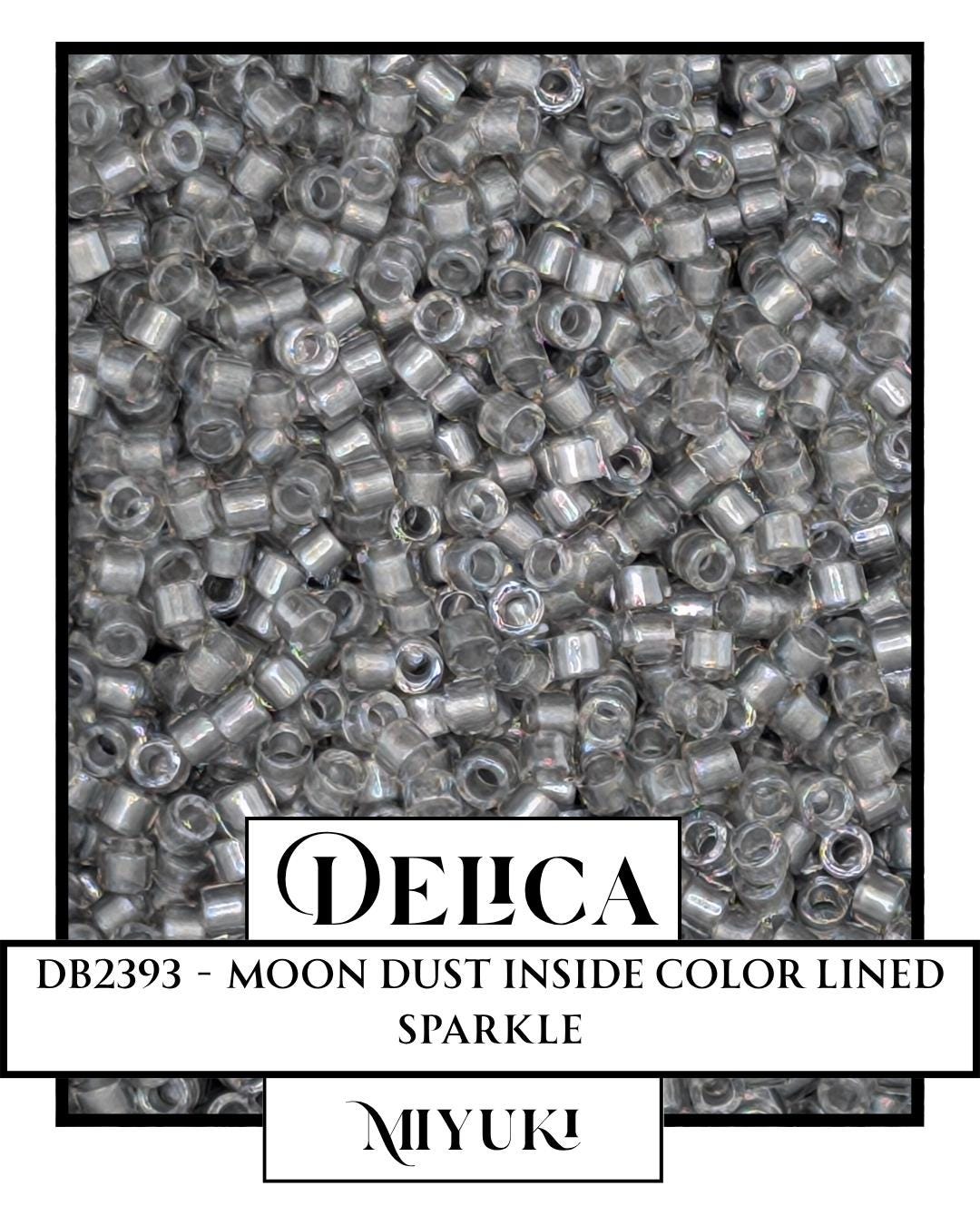 The image is a close-up of a collection of clear, metallic beads or beads with a metallic sheen, possibly made of materials like silver, copper, or bronze. The beads are arranged in a pattern, creating a visually striking and intricate design.