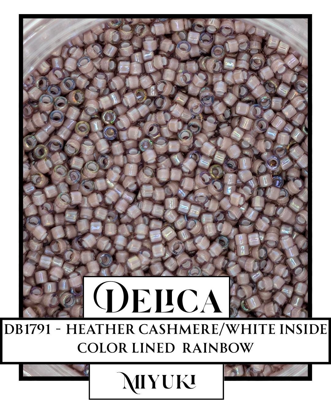 The image is a close-up of a container filled with numerous small beads, likely beads used for crafting or decoration purposes. The beads appear to be made of a material that resembles a combination of white and pink colors, giving them a color-lined rainbow appearance. The image does not contain any text, and the focus is on the beads and their arrangement.