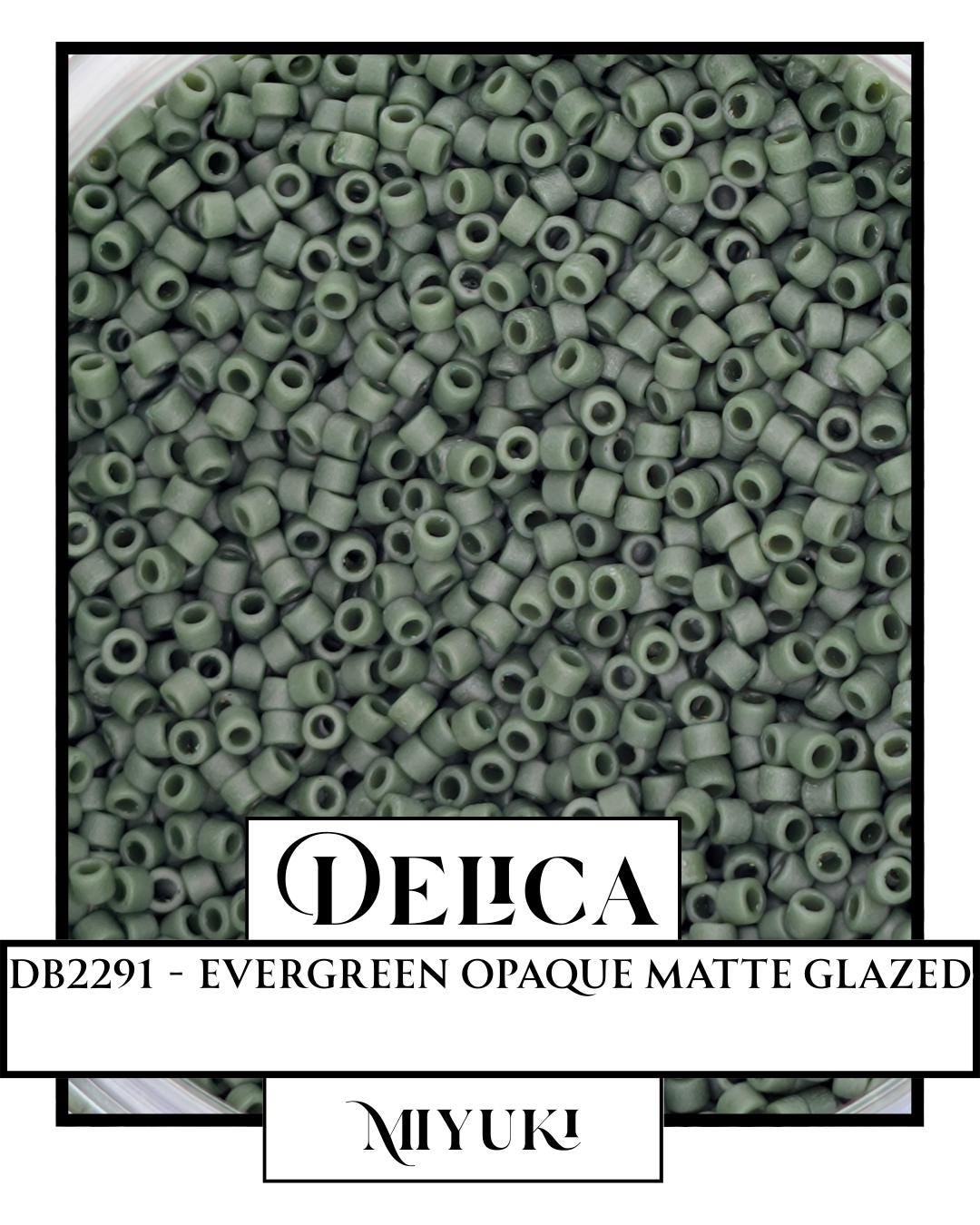 The image is a close-up of a pile of green beads or objects, possibly beads or buttons, arranged in a visually appealing manner.