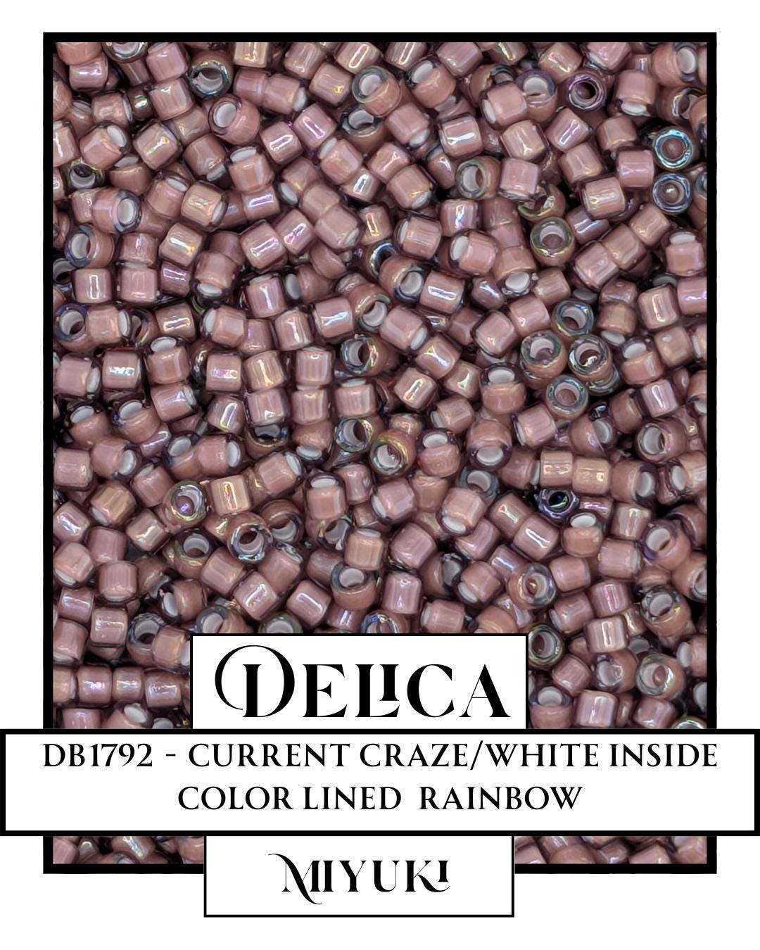 The image is a close-up of a large pile of pink beads, with the text "DELCA" and "DB1792 - Current Craze/White Inside Color Lined Rainbow" visible.