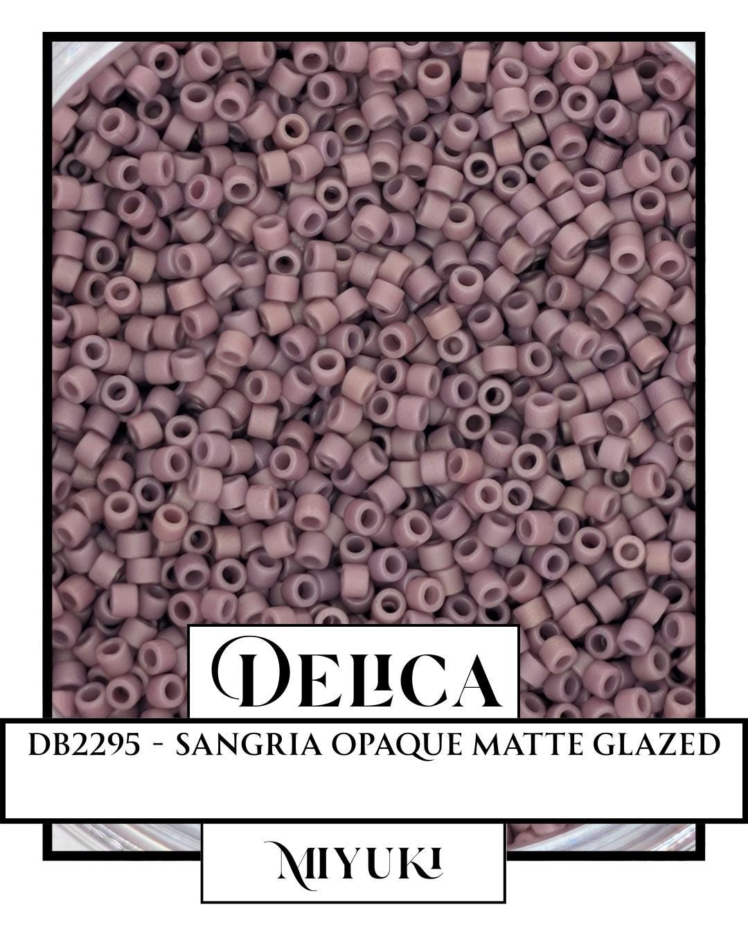 a large pile of pink beads, possibly beads from a craft project or a decorative item.