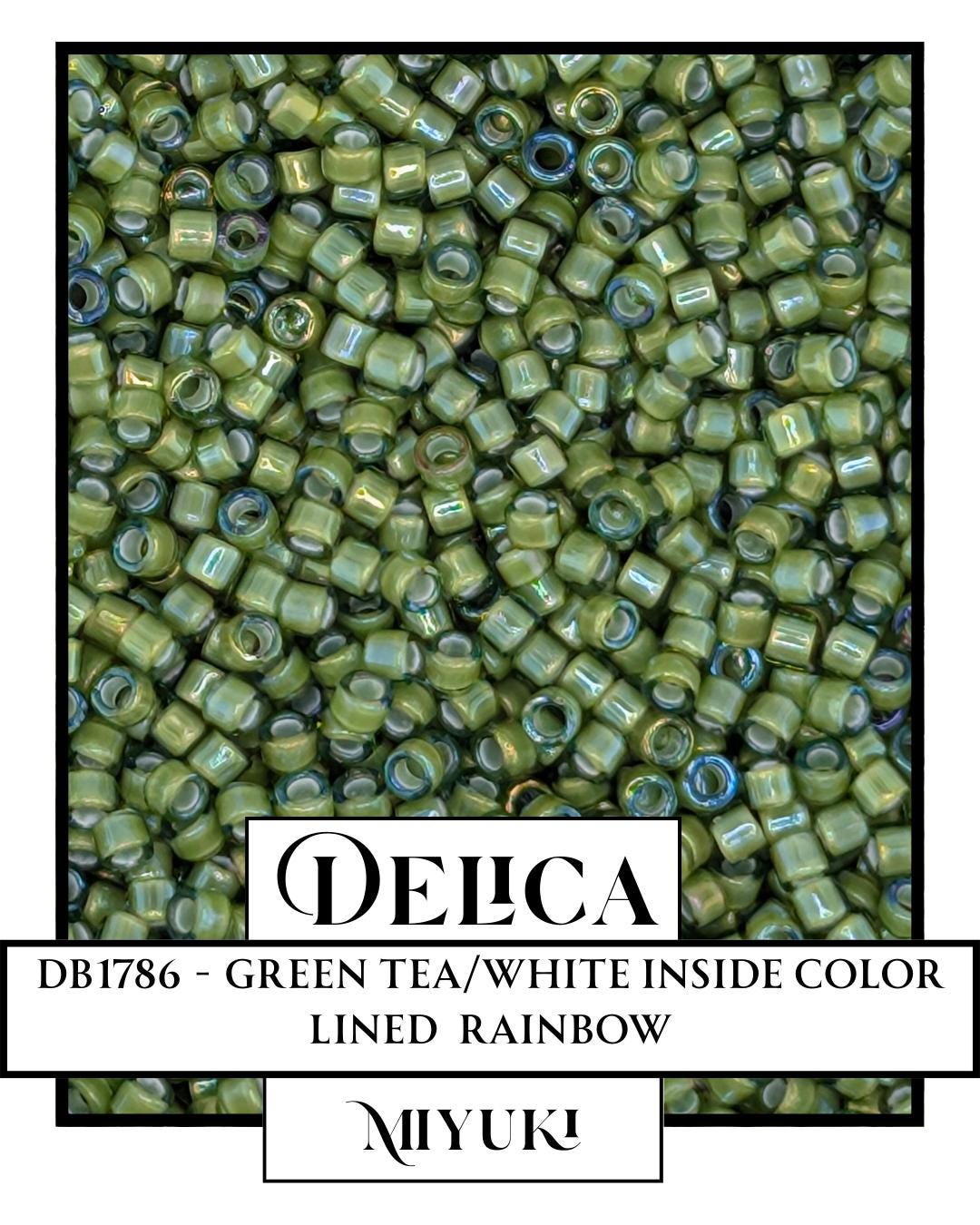 The image is a close-up of a large pile of green beads, with a focus on the color and texture of the beads.