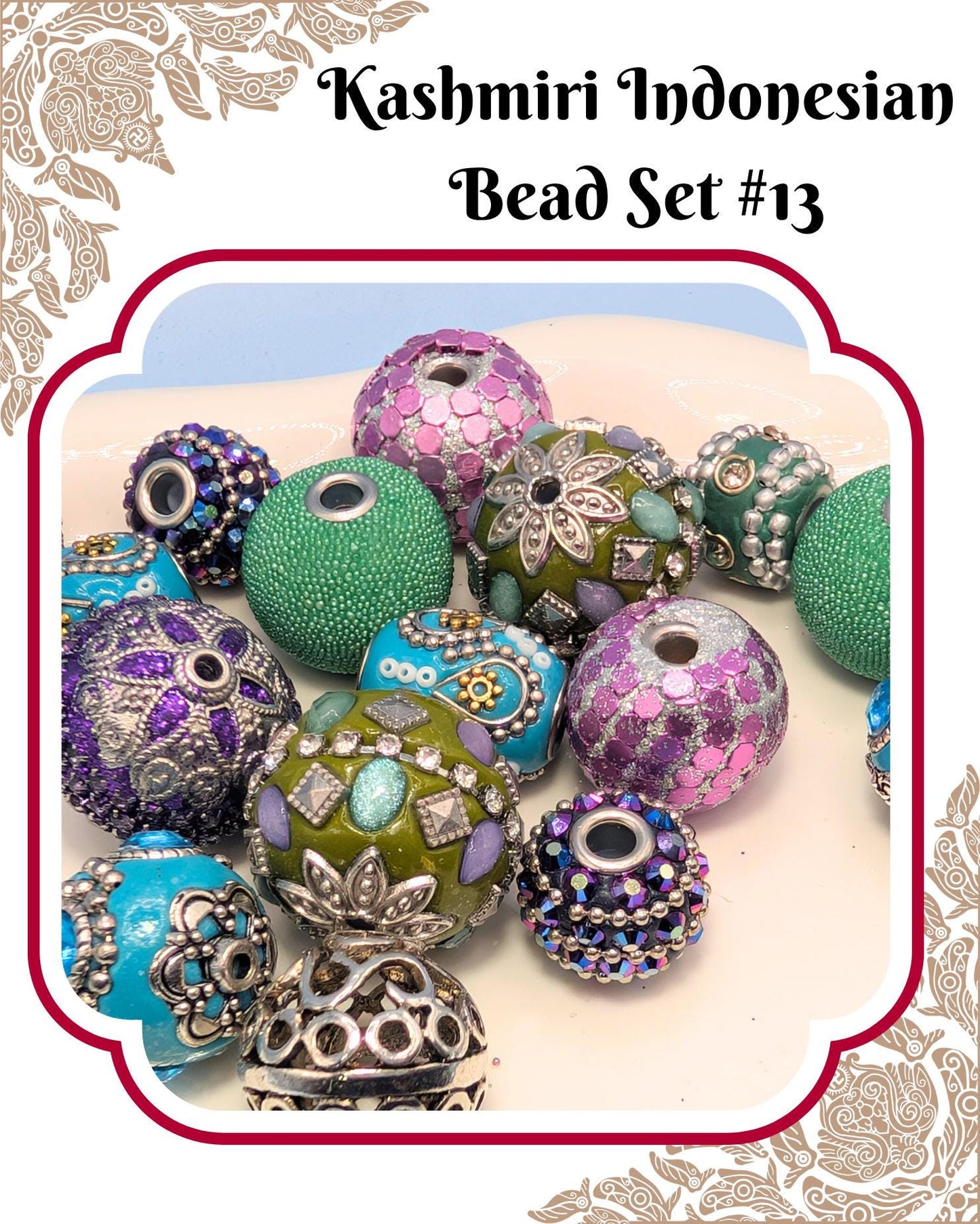 a collection of colorful beads, including green, purple, and blue beads, arranged on a white surface.