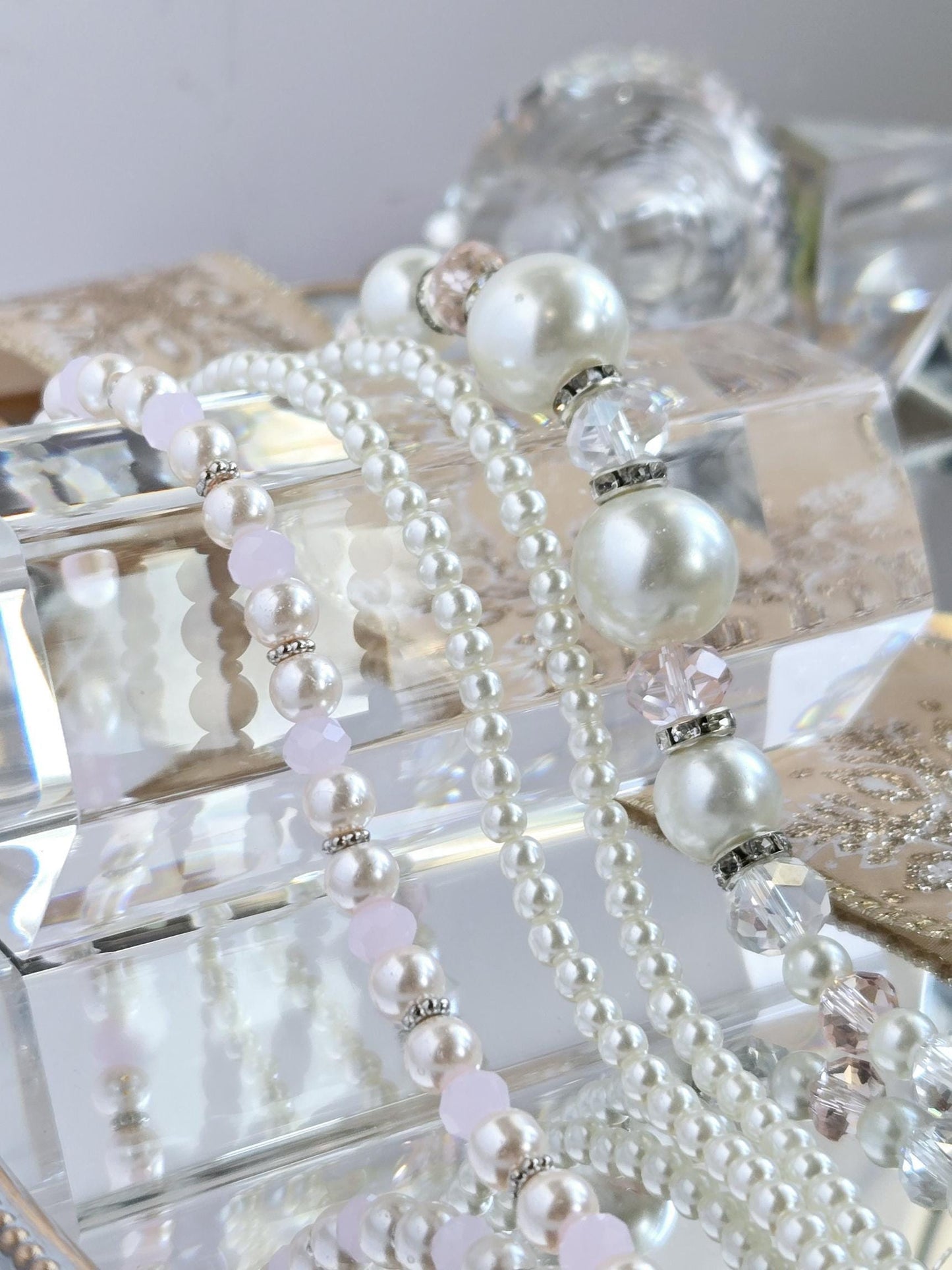Three Strand Packages of Assorted Glass Pearls and Spacer Beads