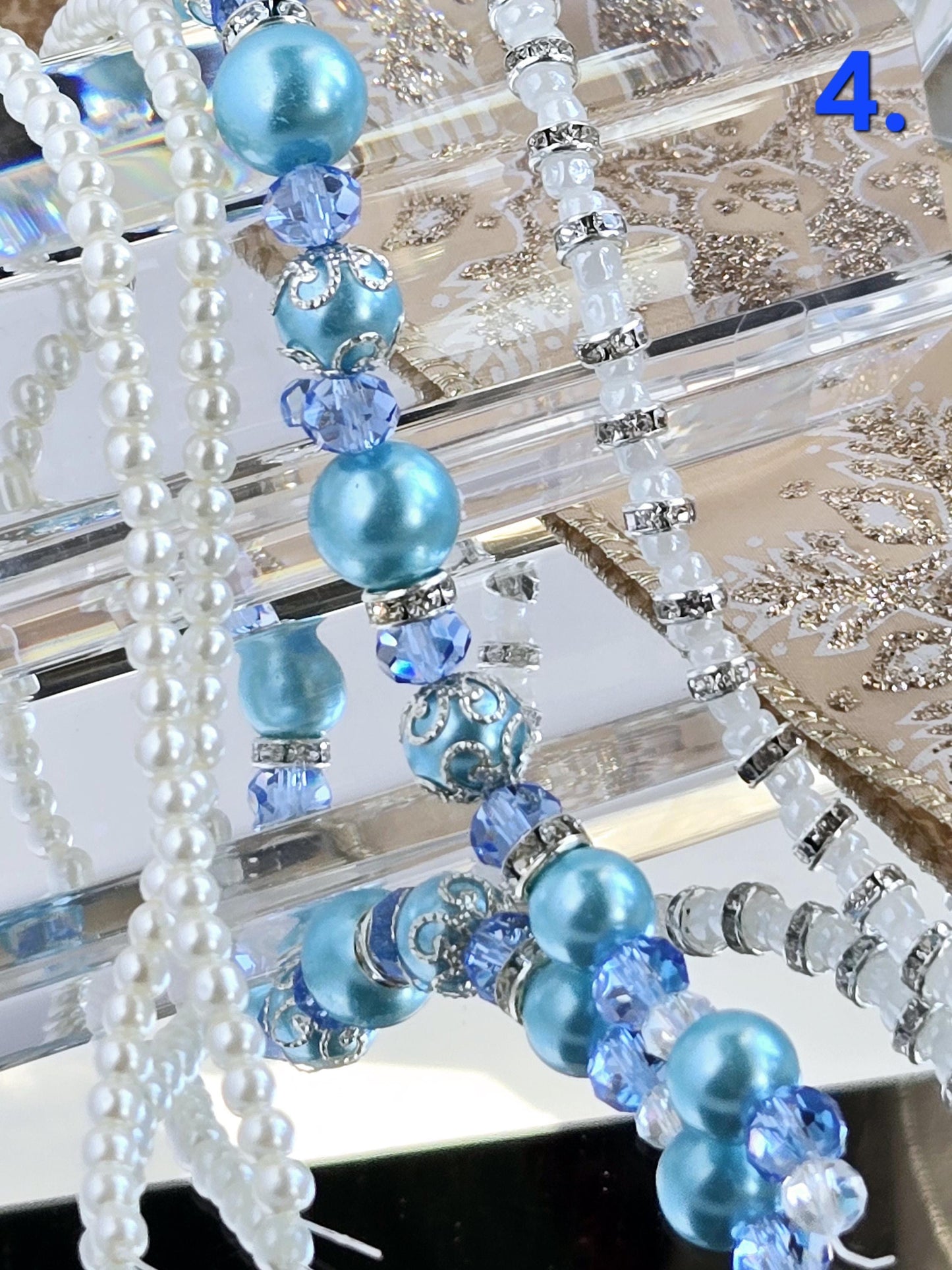 Three Strand Packages of Assorted Glass Pearls and Spacer Beads