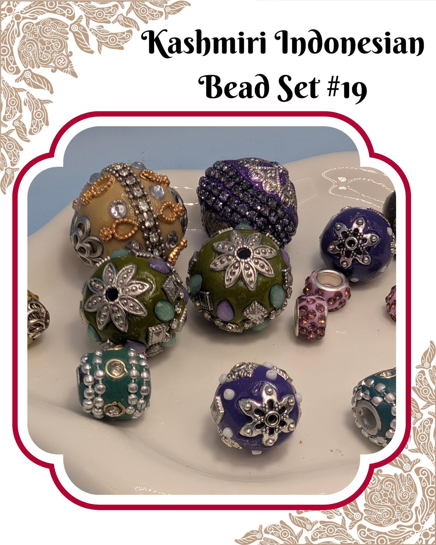 A collection of colorful and intricately designed beads, including various shapes and sizes, arranged on a white surface.