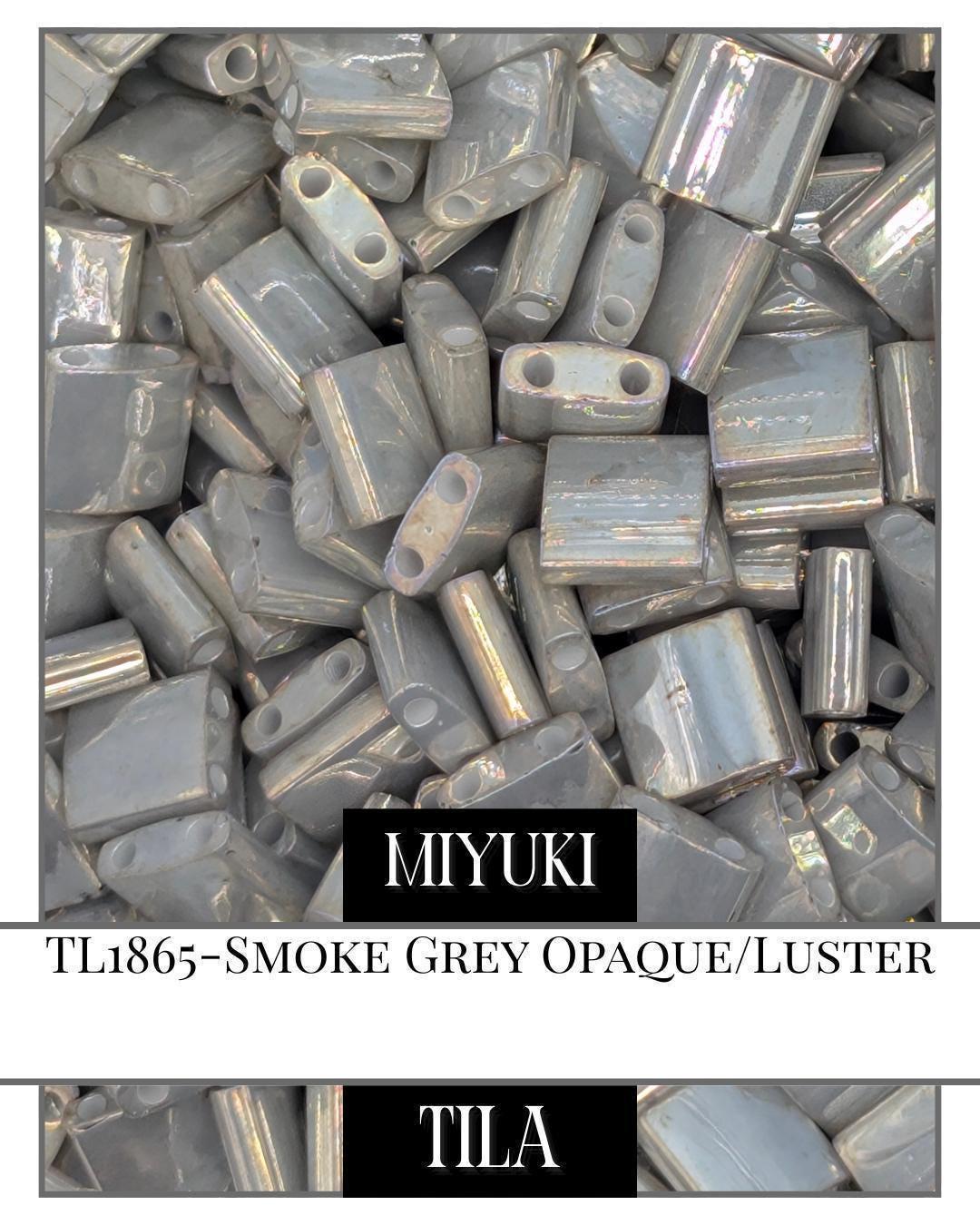 TL1865-Miyuki Tila Beads:Smoke Grey O/L (7.5g pkg)