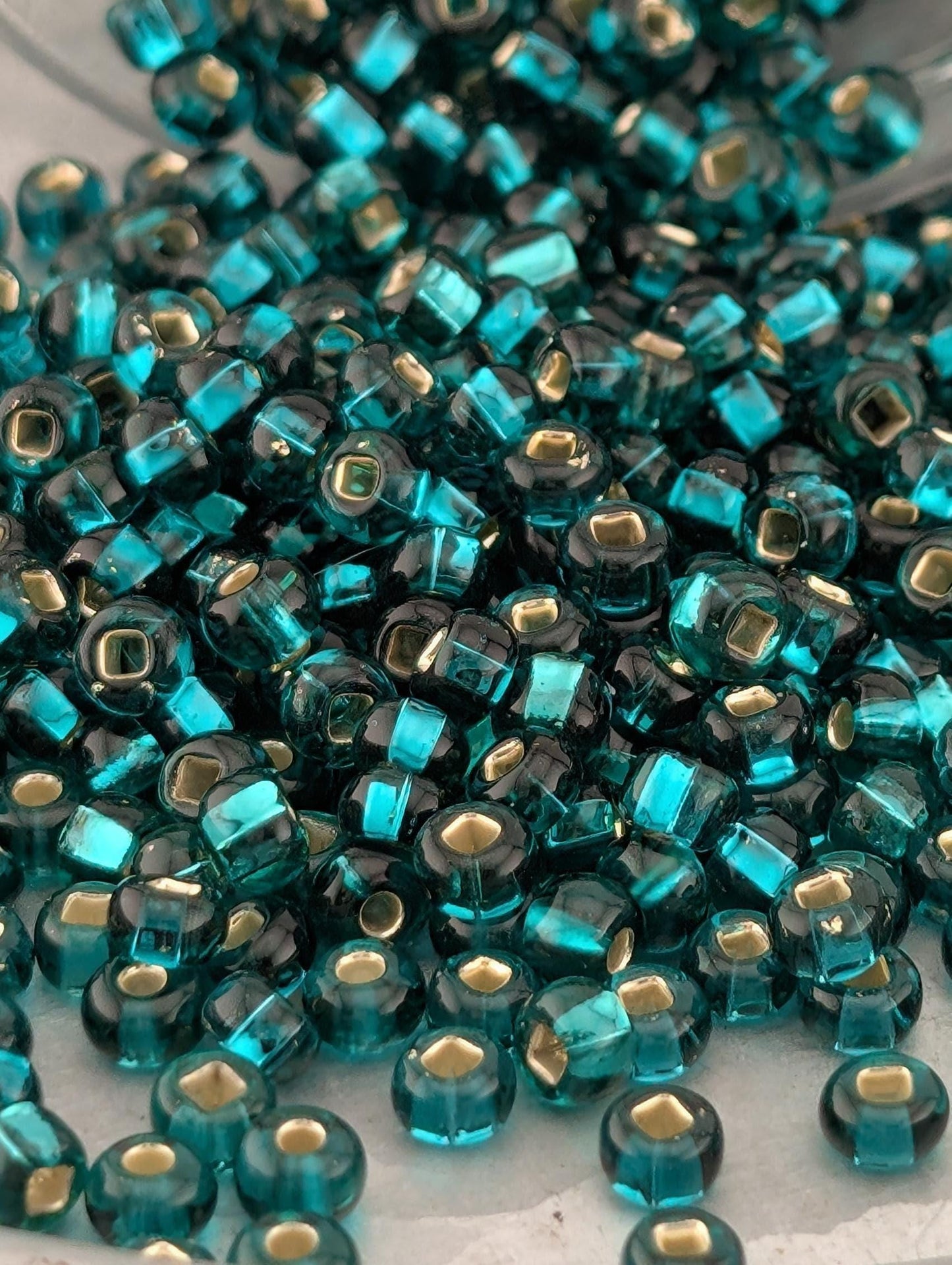 Transparent Teal Green Silver-Lined Size 6/0 15g pkg