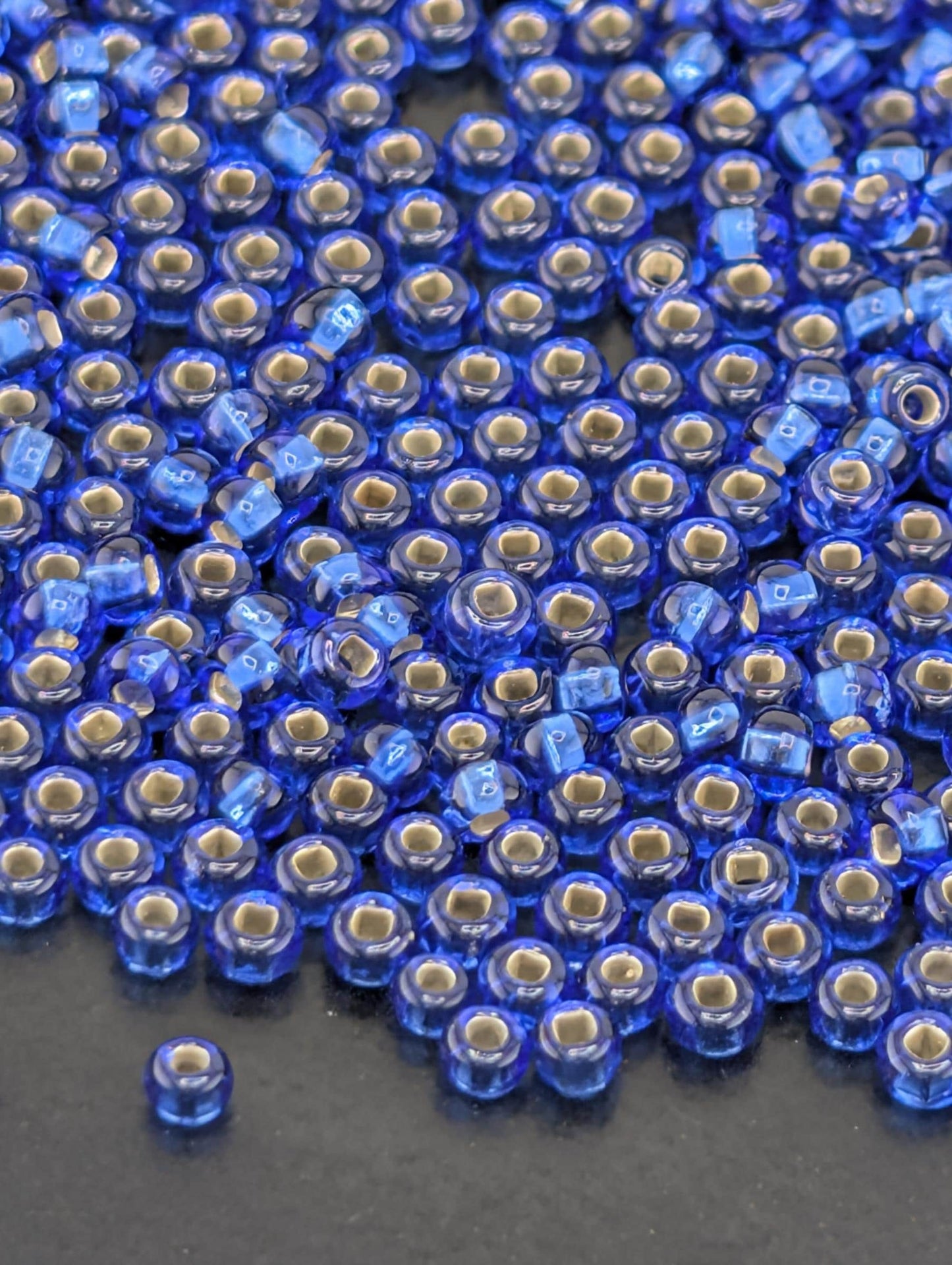 Transparent Silver-Lined Sapphire Blue Size 11/0 15g pkg