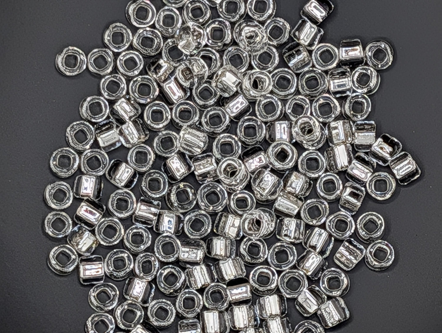 5101SB Silver Lined Translucent Clear Round With Square Hole 6/0 (15g Pkg)