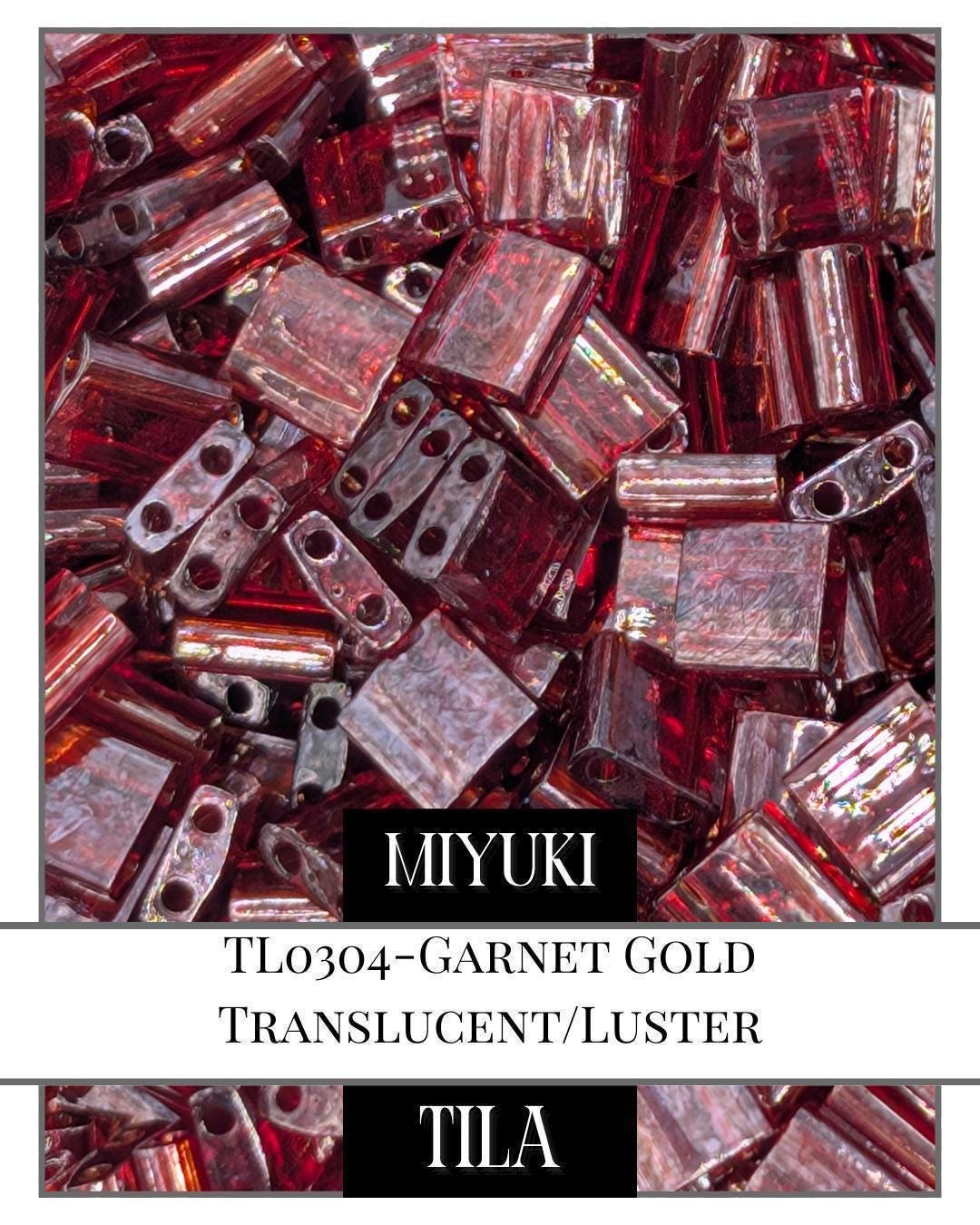 TL0304-Miyuki Tila Beads:Garnet Gold T/L (7.5g pkg)