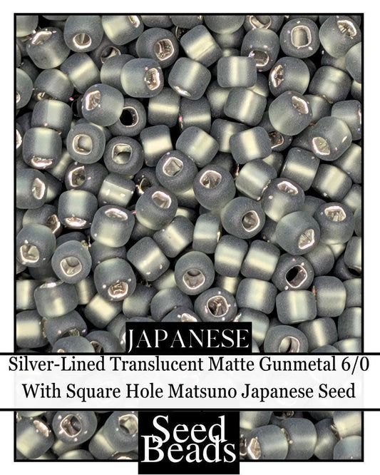 5803SB Silver-Lined Translucent Matte Gunmetal 6/0 With Square Hole (15g pkg)