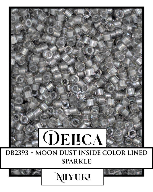 The image is a close-up of a collection of clear, metallic beads or beads with a metallic sheen, possibly made of materials like silver, copper, or bronze. The beads are arranged in a pattern, creating a visually striking and intricate design.