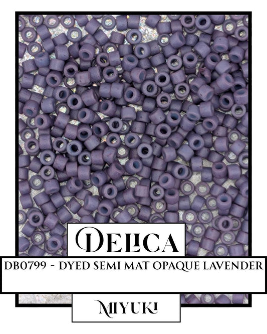 The image is a close-up of a pile of purple beads, possibly beads from a craft project or a decorative element.