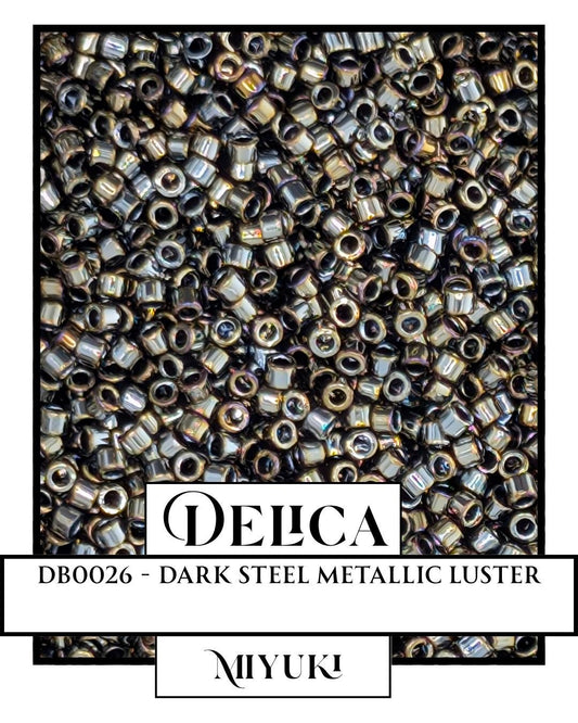The image is a close-up of a pile of metallic beads, with a focus on the dark steel metallic luster of the beads.
