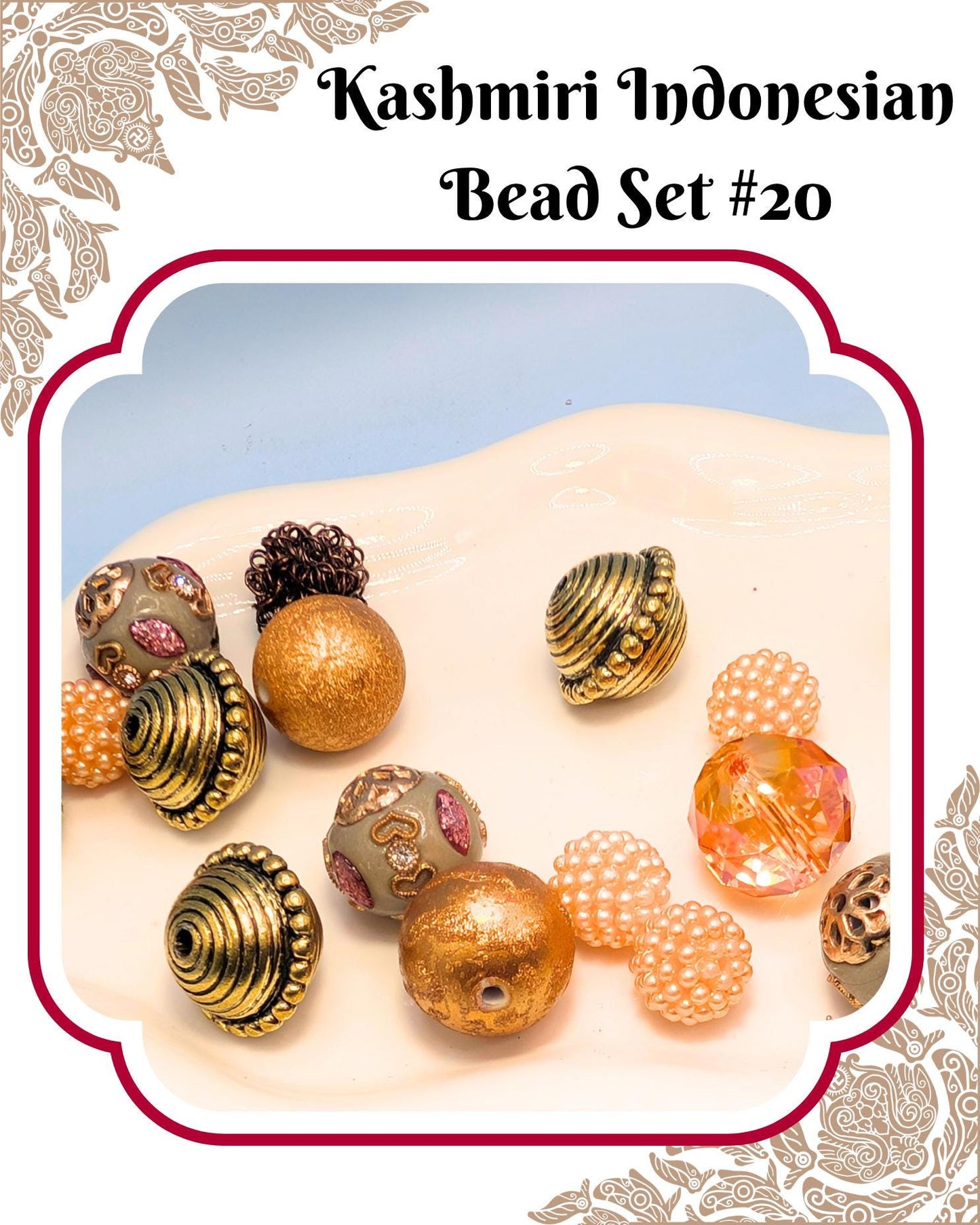 A collection of colorful beads, including gold, silver, and pearl-like beads, arranged on a white surface.