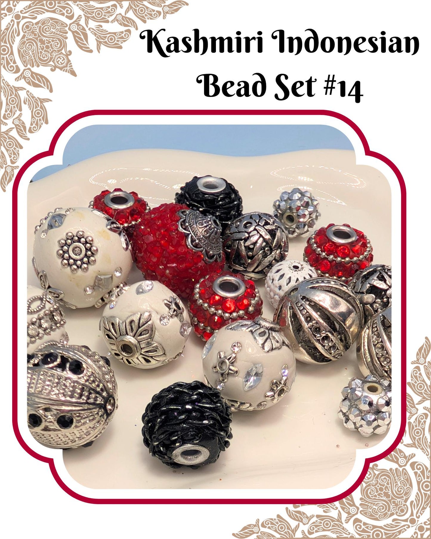 A collection of colorful beads, including red, silver, and white beads, arranged on a white surface.