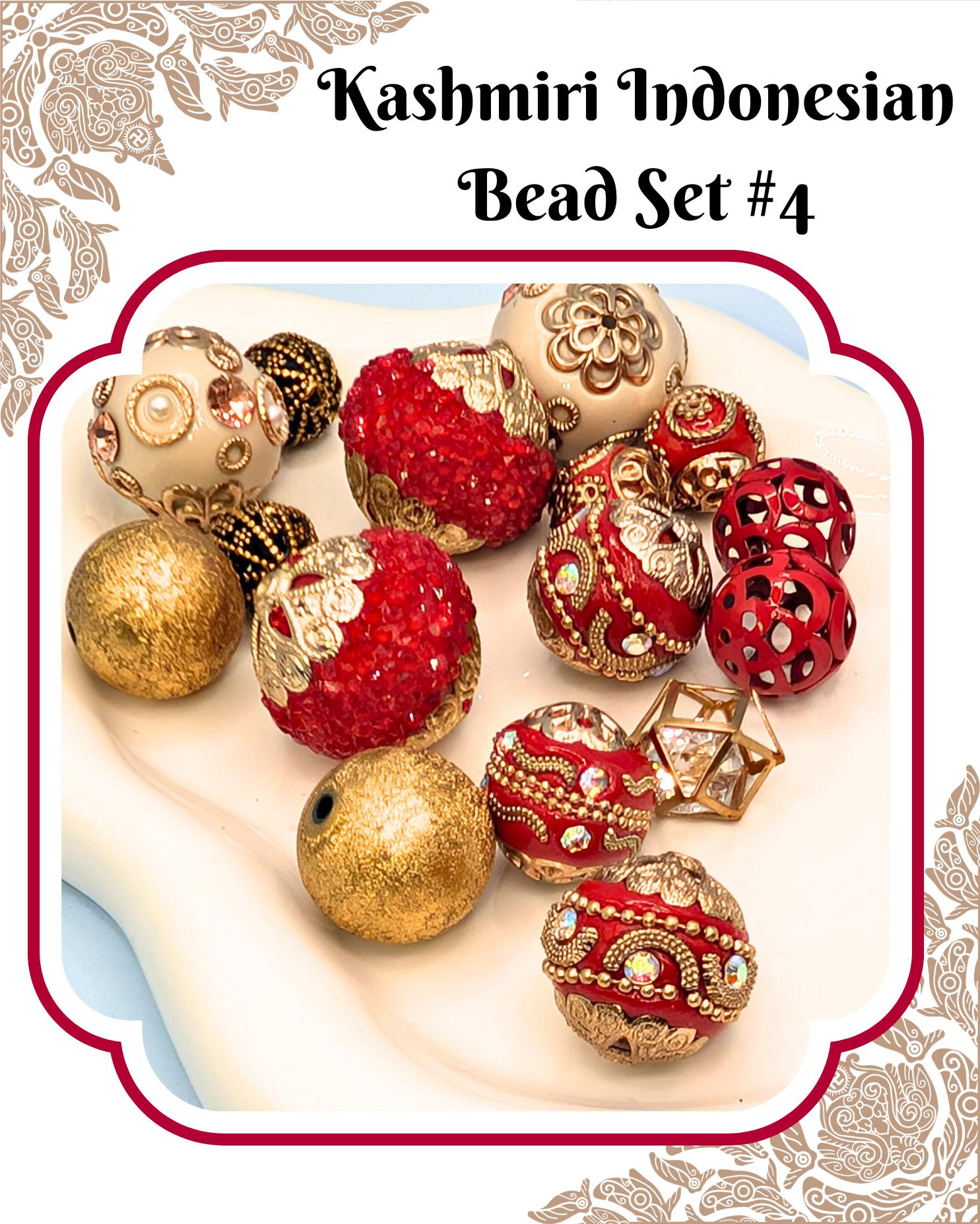a collection of ornate, colorful beads in various shapes and sizes, including red, gold, and silver beads, arranged on a white surface.