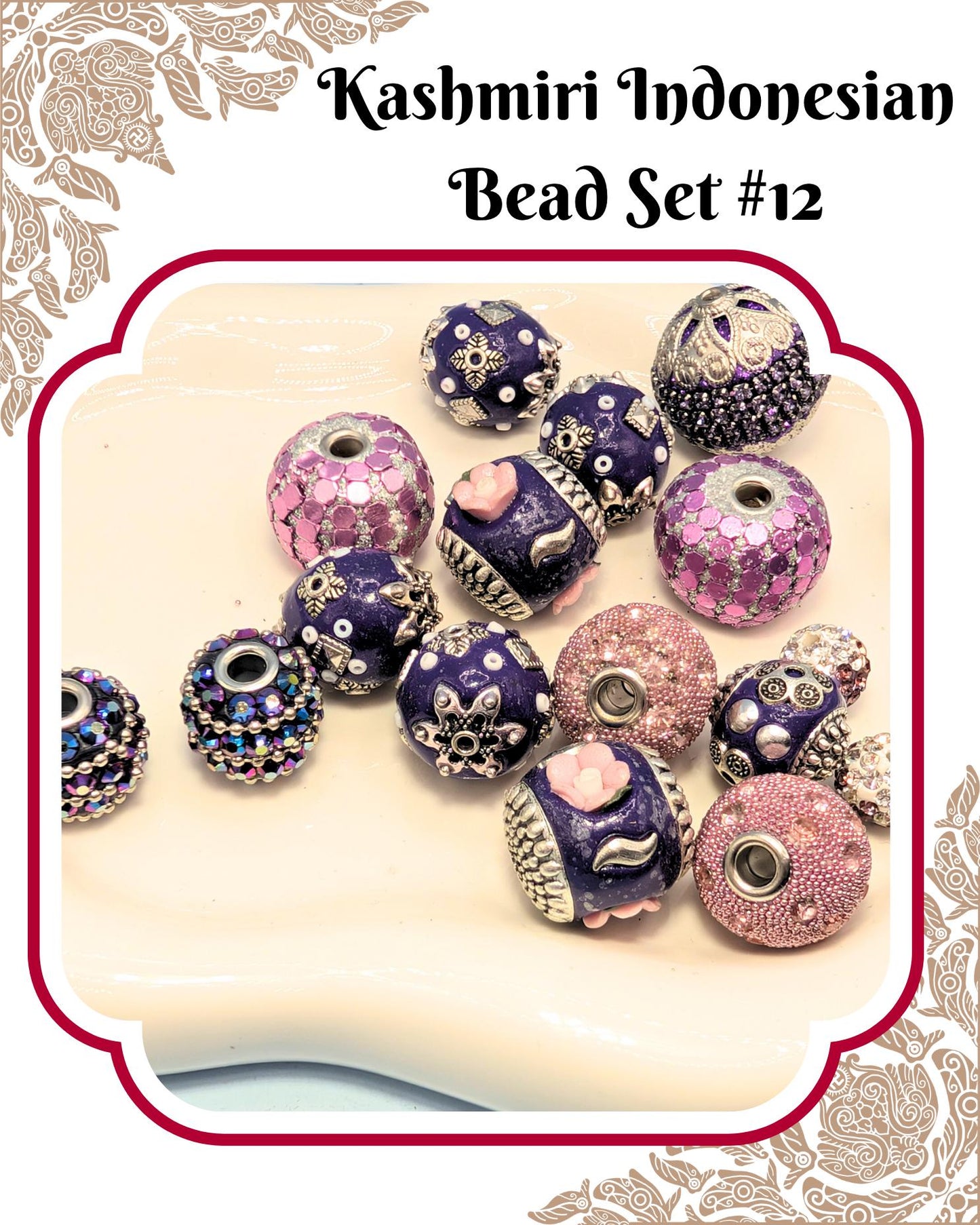 A collection of colorful beads, including purple, pink, and blue ones, arranged on a white surface.