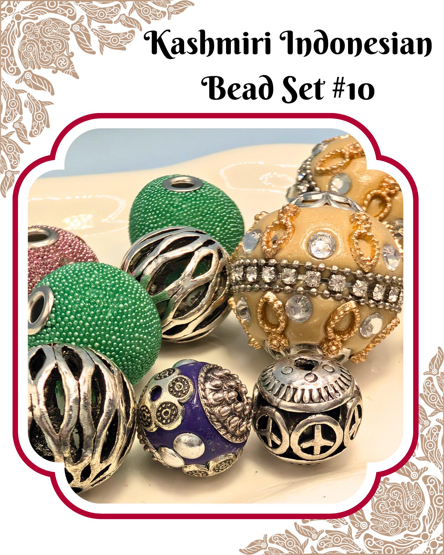 a collection of colorful beads, including green, purple, and gold beads, arranged on a surface.