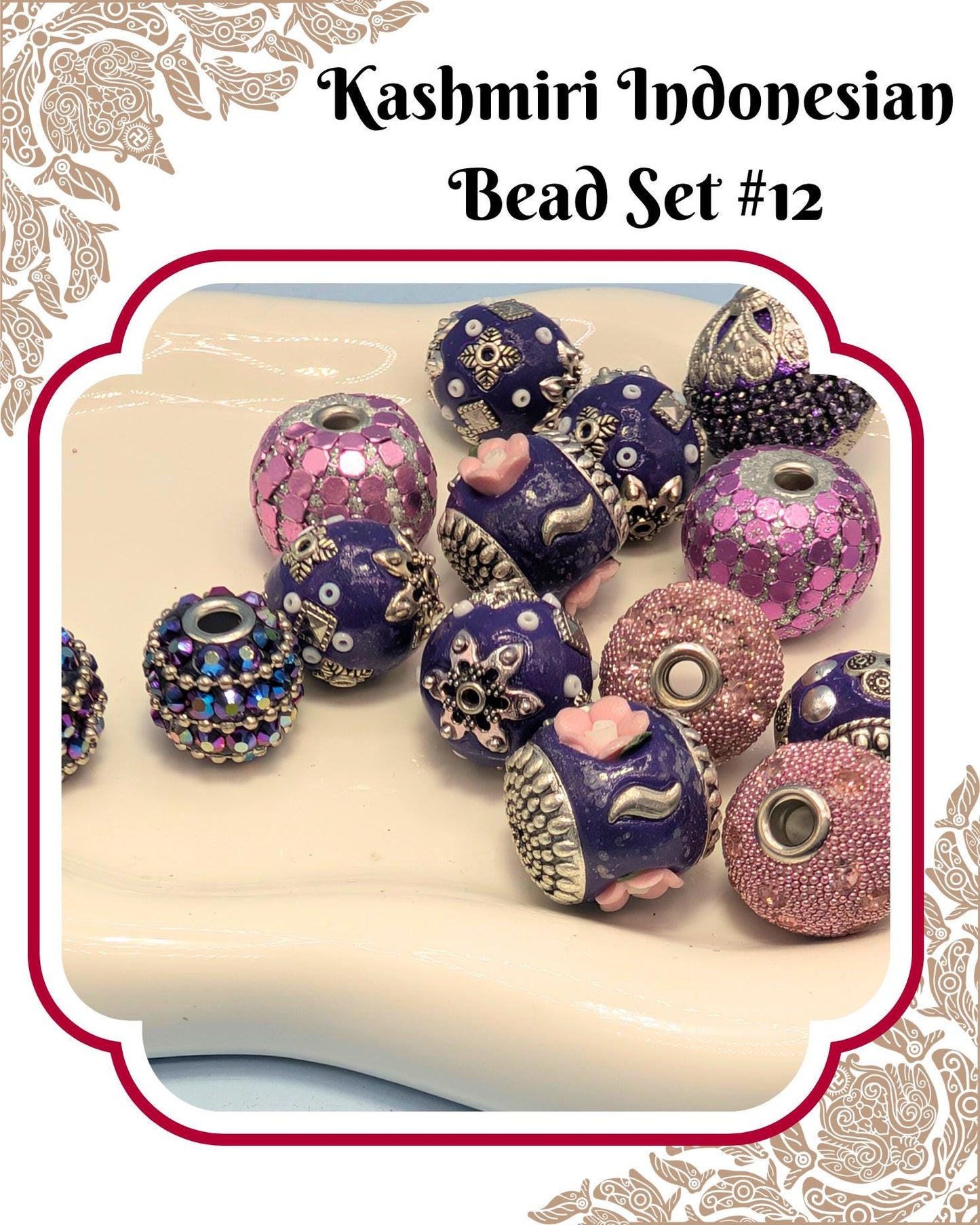 A collection of colorful, intricately designed beads in shades of purple, pink, and blue, arranged on a white surface.