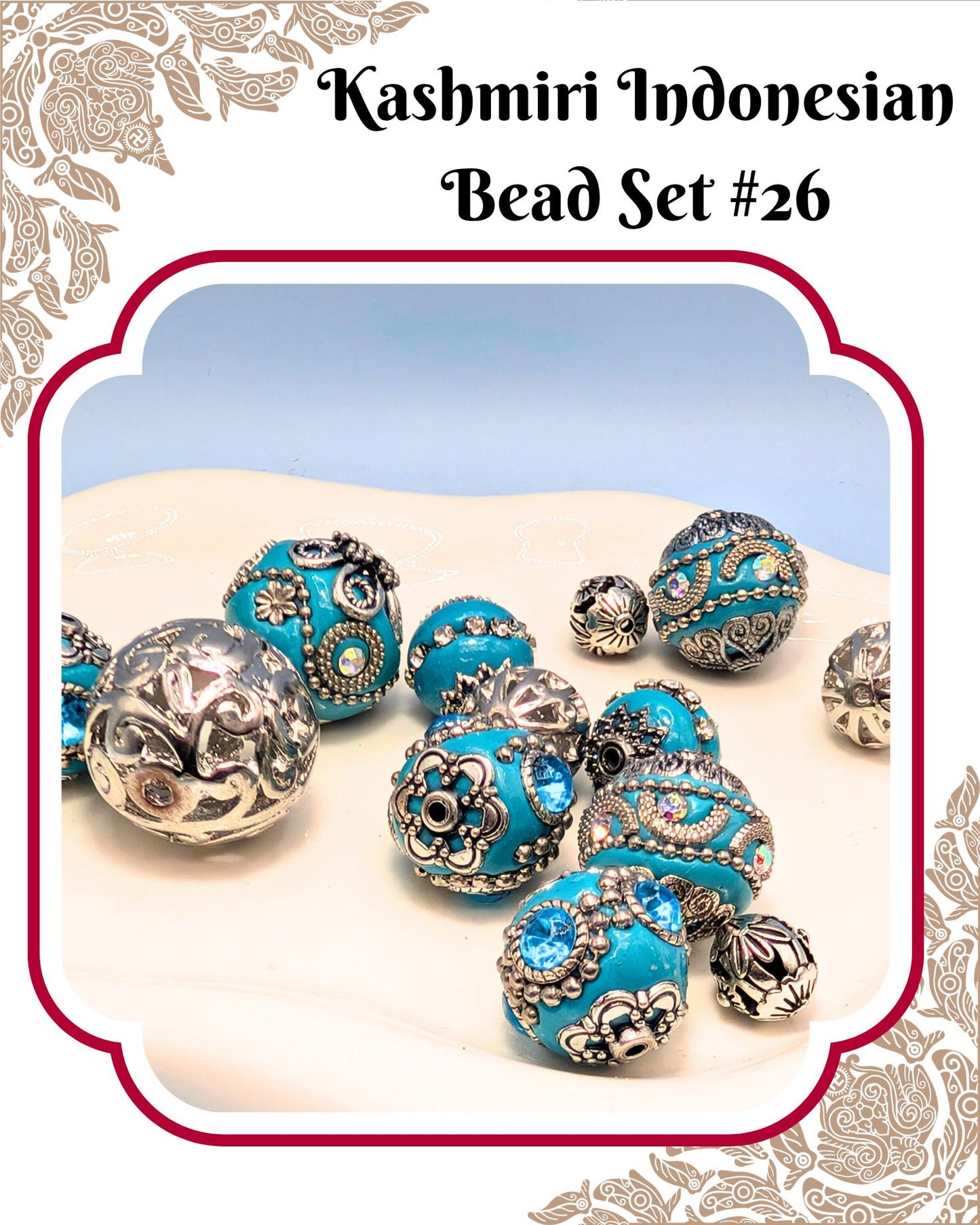 A collection of ornate, turquoise-colored beads with intricate designs, arranged on a white surface.