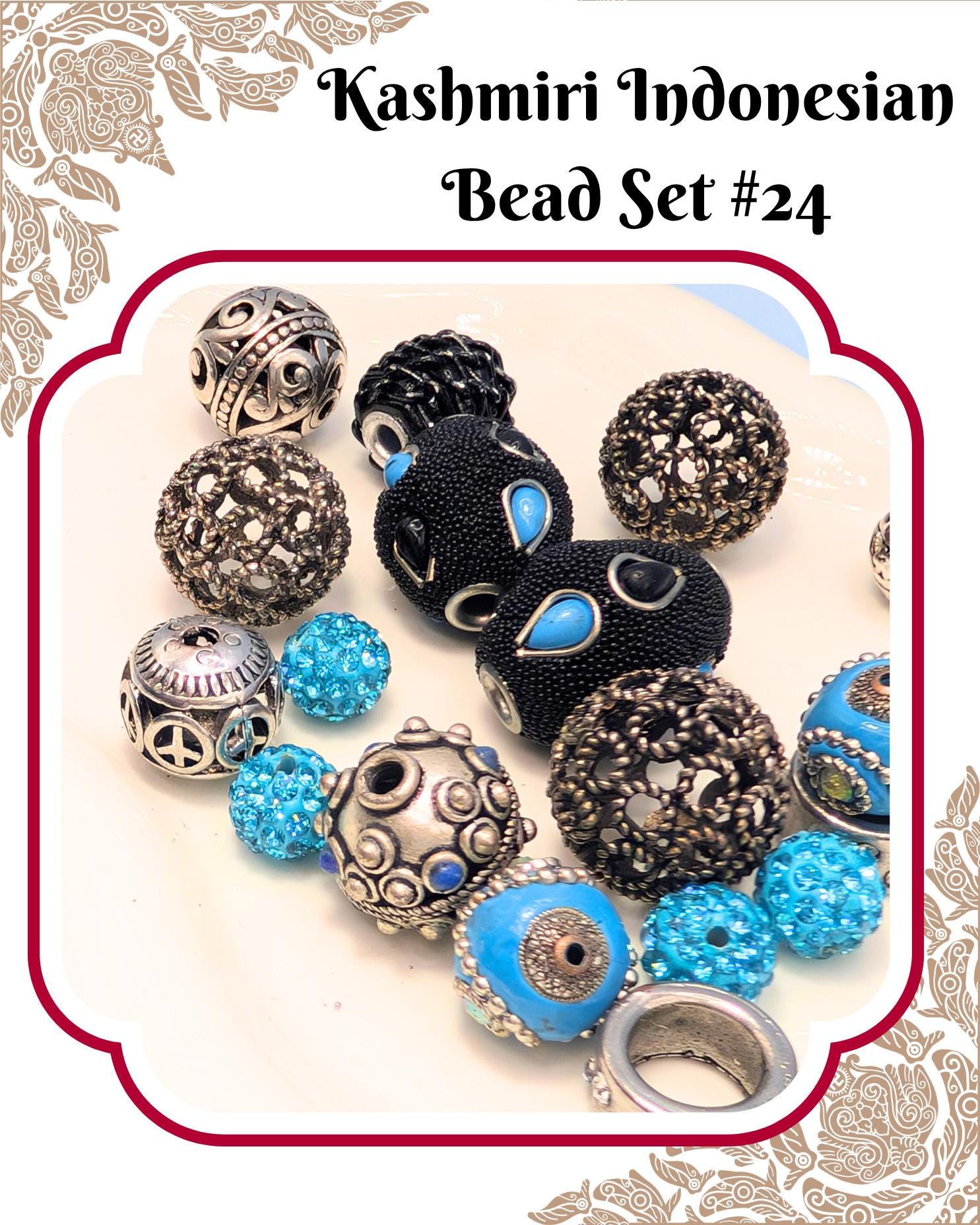 A collection of colorful beads, including silver, blue, and black beads, arranged on a white background.