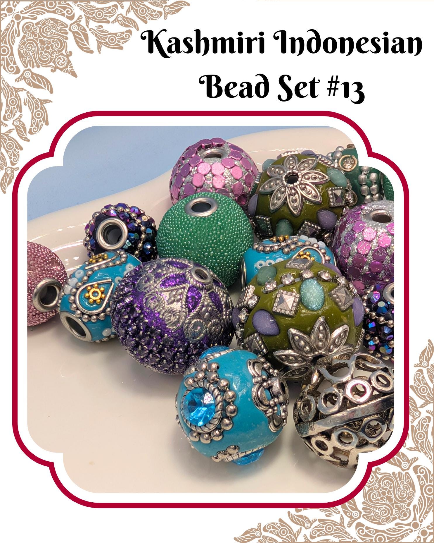 A collection of colorful, intricately designed beads in various shapes and sizes, including round, oval, and spherical beads, arranged on a white surface.
