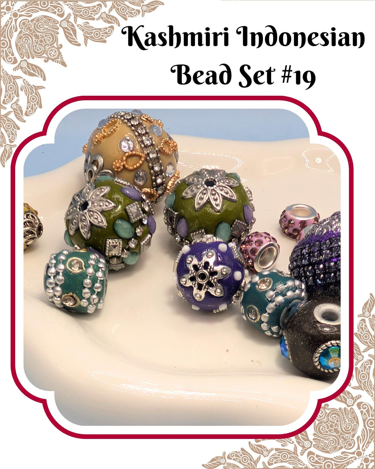 A collection of colorful and intricately designed beads, including various shapes and sizes, arranged on a white surface.