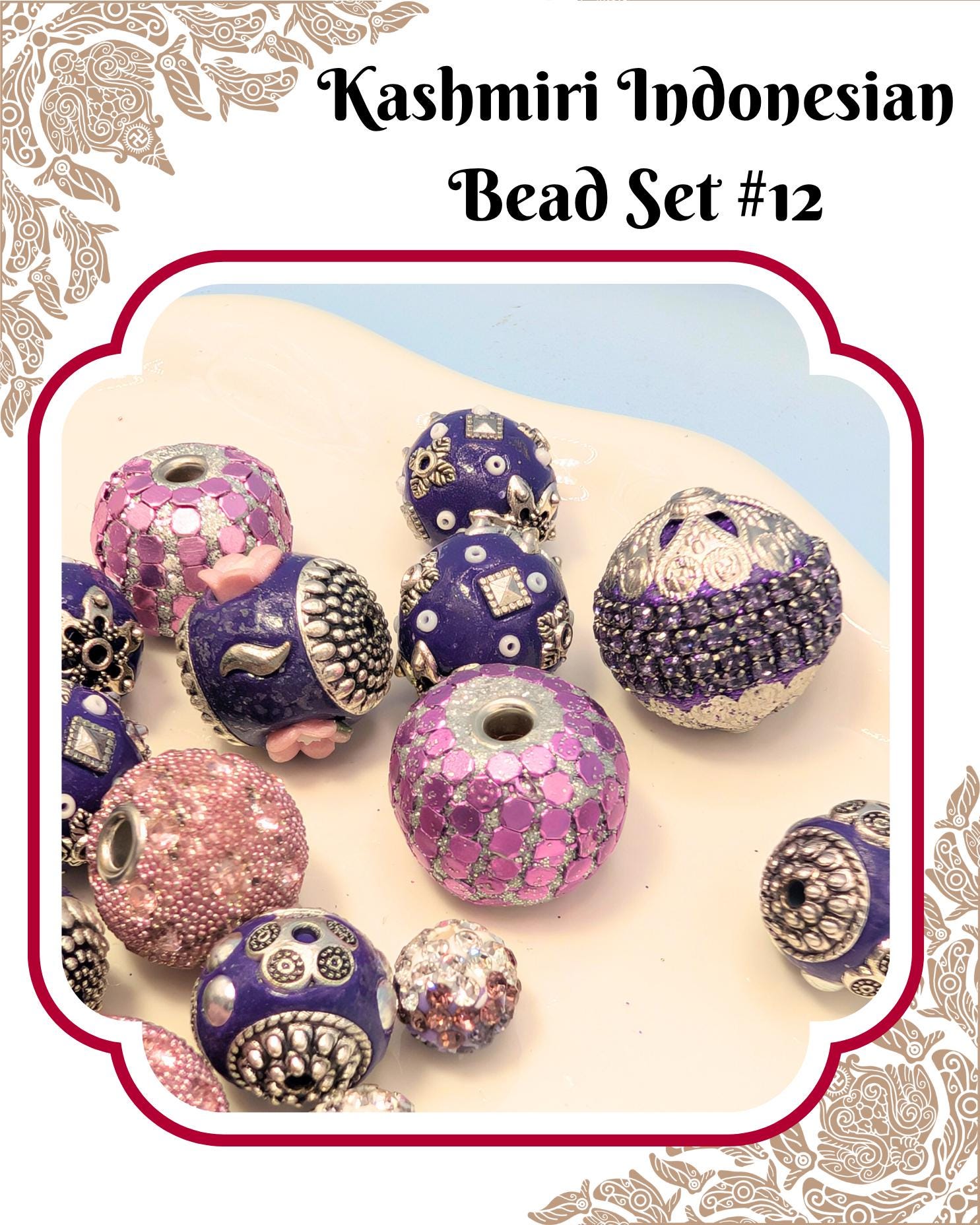 a collection of colorful, intricately designed beads in shades of purple, pink, and silver, arranged on a white surface.