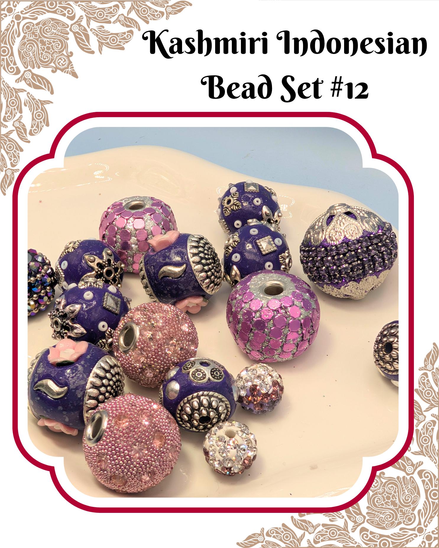 a collection of colorful beads, including purple, pink, and silver ones, arranged on a surface.