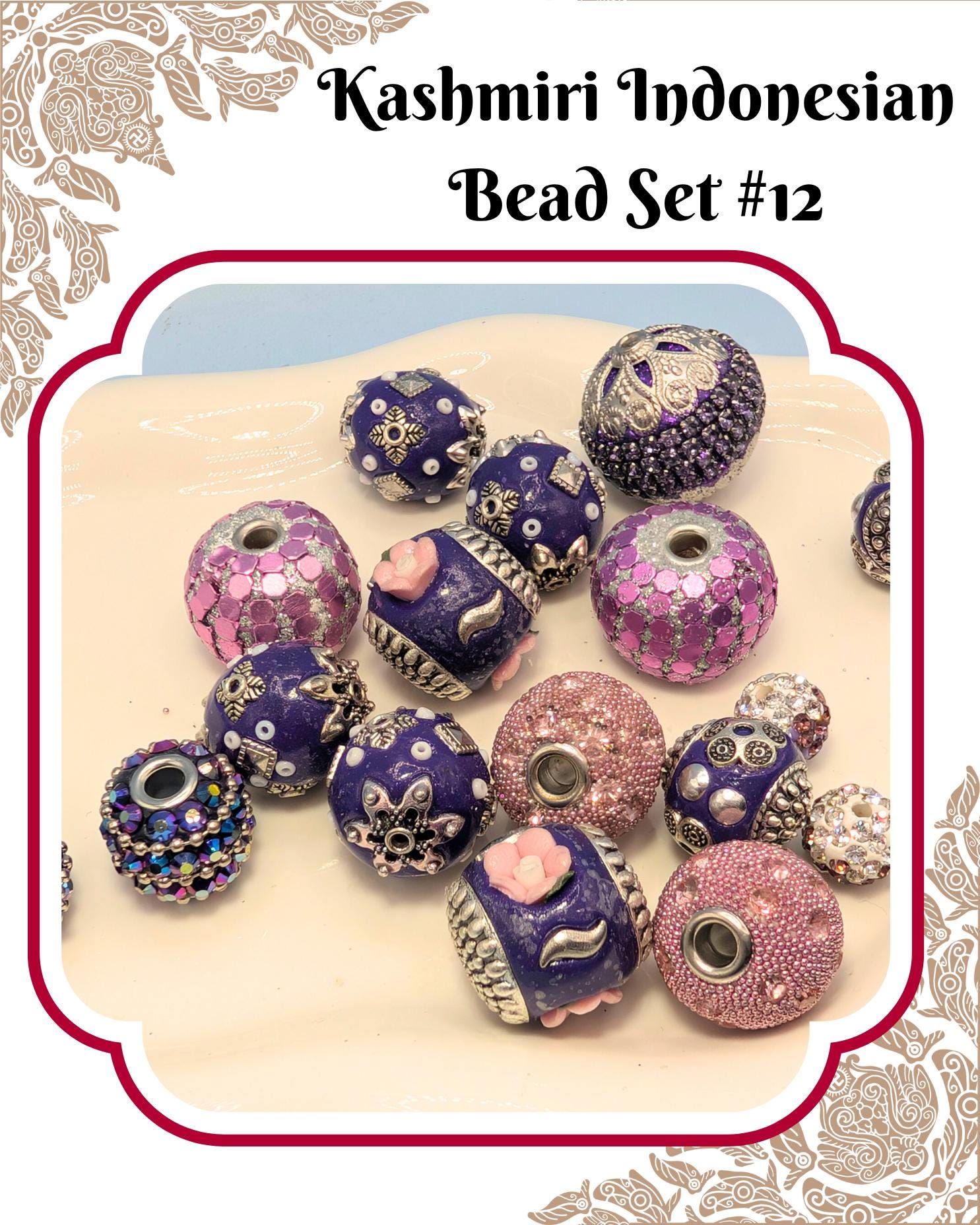A collection of colorful, intricately designed beads in shades of purple, pink, and blue, arranged on a white surface.