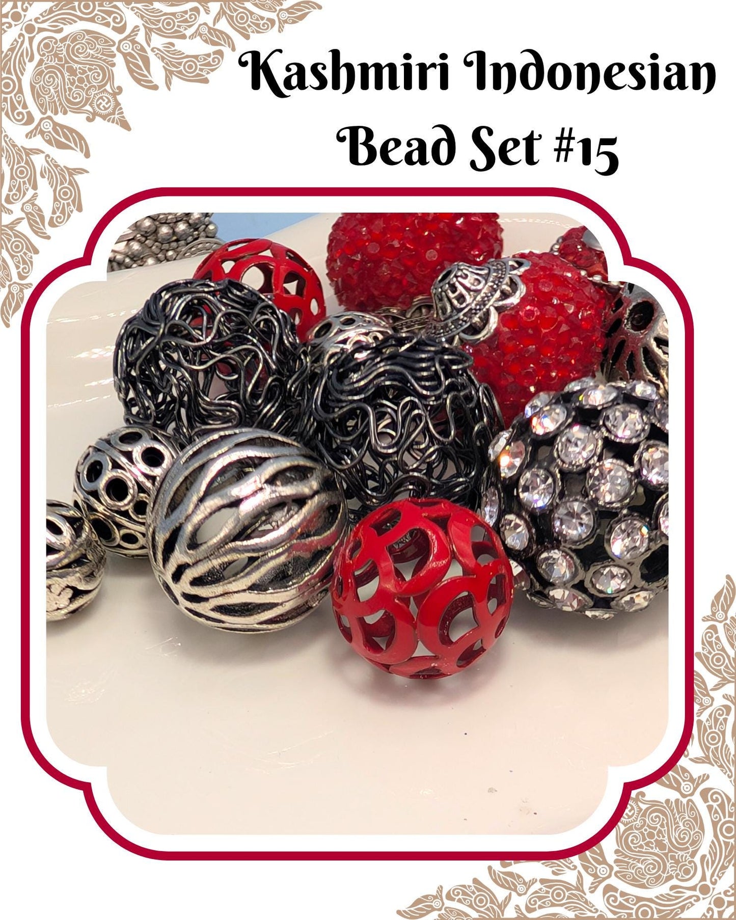 A collection of various beads, including metallic and colorful beads, arranged on a white surface.