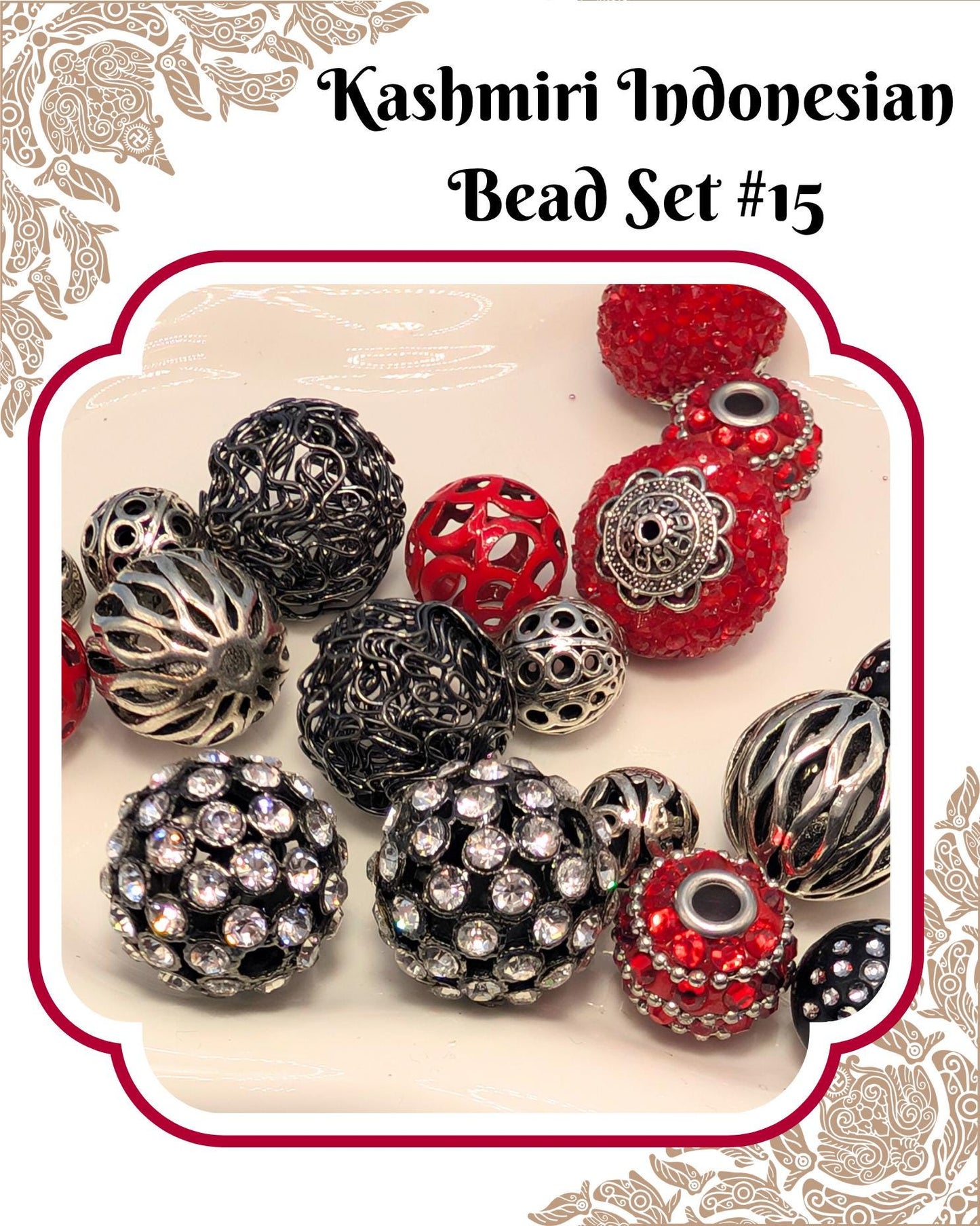 a collection of various beads, including black, silver, and red beads, arranged on a white background.