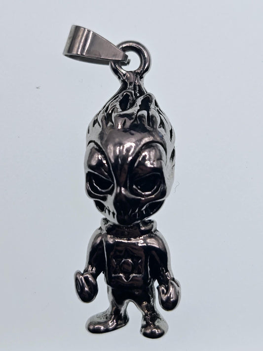 A shiny metal pendant in the shape of a small, metallic figure.