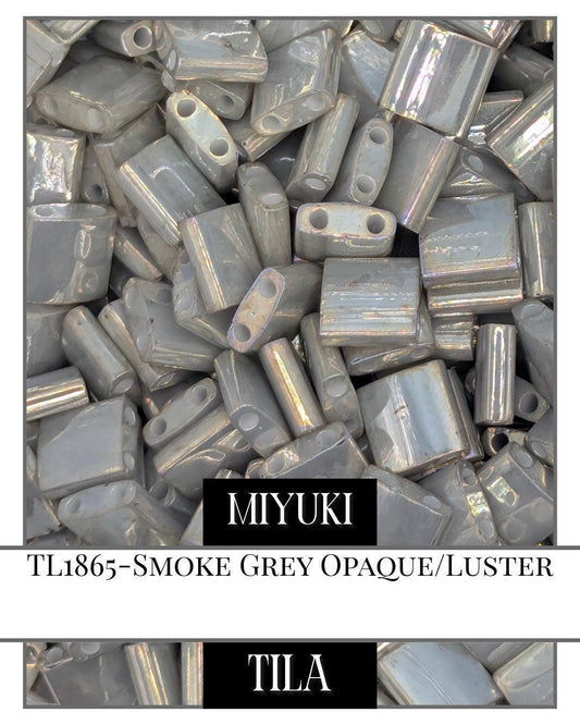 TL1865-Miyuki Tila Beads:Smoke Grey O/L (7.5g pkg)