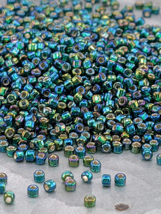 4567SB  Translucent Silver Lined Rainbow Dark Green   11/0