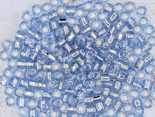5125SB Silver Lined Translucent Light Blue Round With Square Hole 6/0 (15g Pkg)