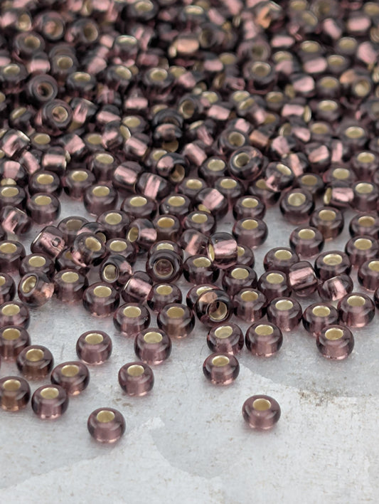 a close-up view of numerous small, round beads scattered across a surface.