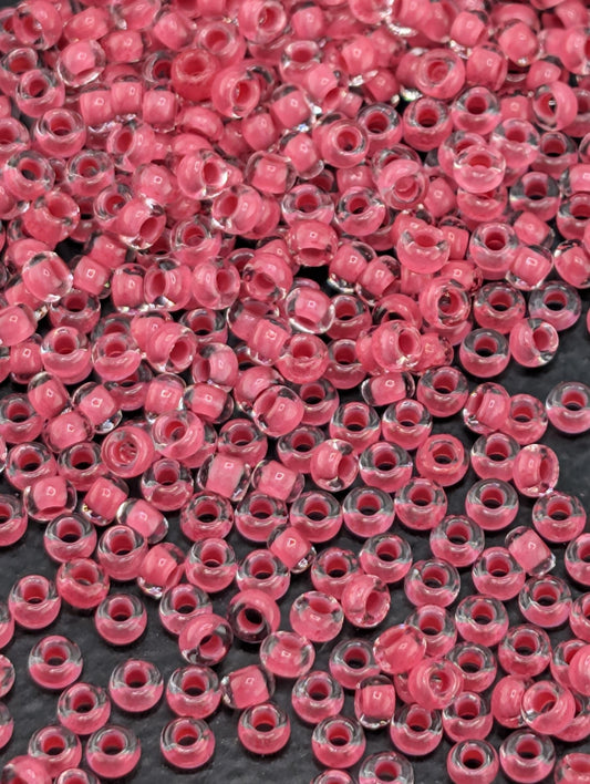 Transparent Terra Intensive Pink Lined Clear Size 11/0 15g pkg