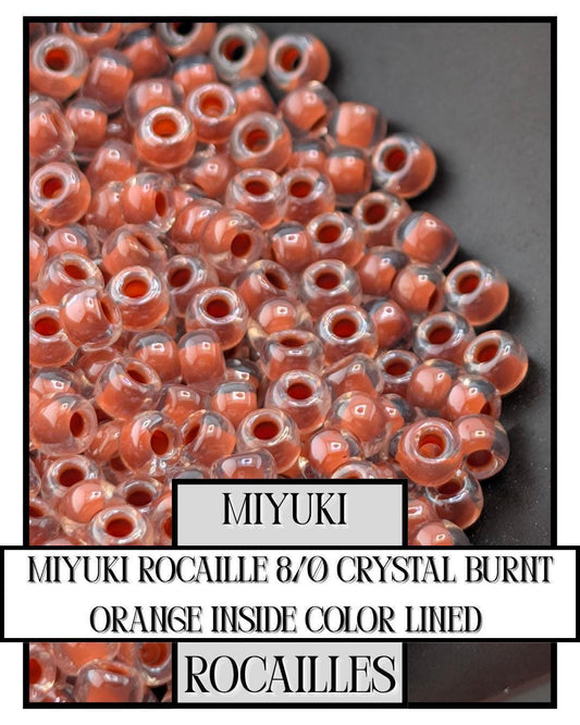 11-0214 Miyuki Rocailles 11/0 | Crystal/Burnt Orange Inside Color Lined 20g