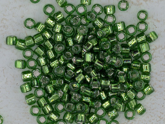 5146SB Silver Lined Translucent Lime Round With Square Hole 6/0 (15g Pkg)