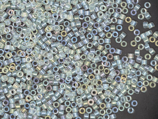 numerous small, clear beads scattered across a dark background.