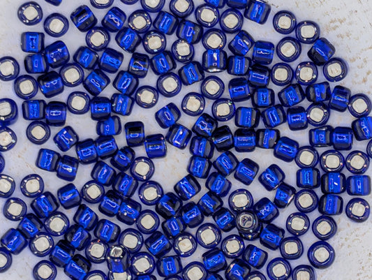5131SB Silver Lined Translucent Cobalt Round With Square Hole 6/0 (15g Pkg)