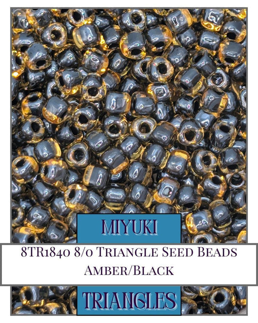 8TR1840-Miyuki Triangle Beads:Amber/Black ICL (10g pkg)
