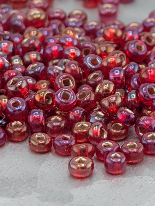 Transparent Silver-Lined Red Rainbow 6/0 15g pkg