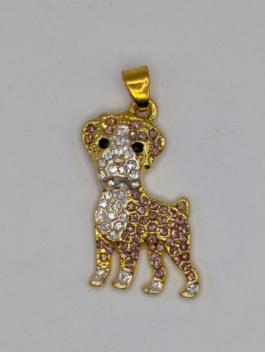 A gold-colored pendant in the shape of a dog, adorned with numerous small diamonds.