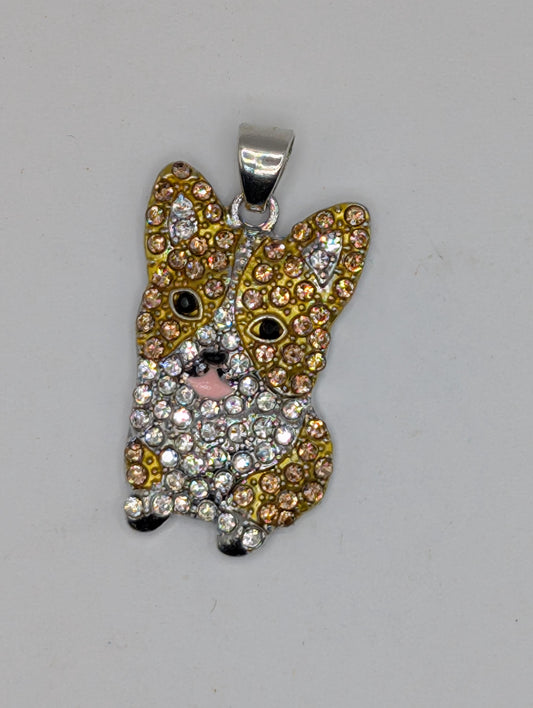 A pendant in the shape of a dog&#39;s head, adorned with sparkling rhinestones in various colors.