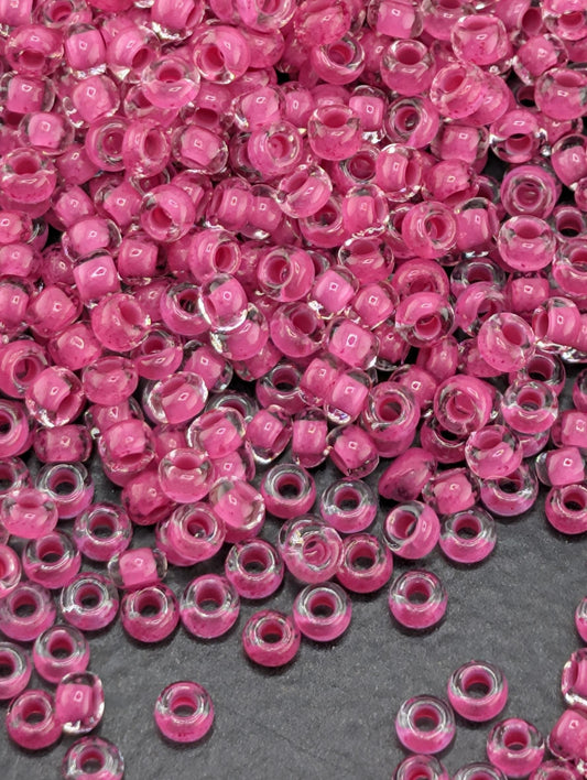 Transparent Terra Intensive Magenta Lined Clear Size 11/0 15g pkg
